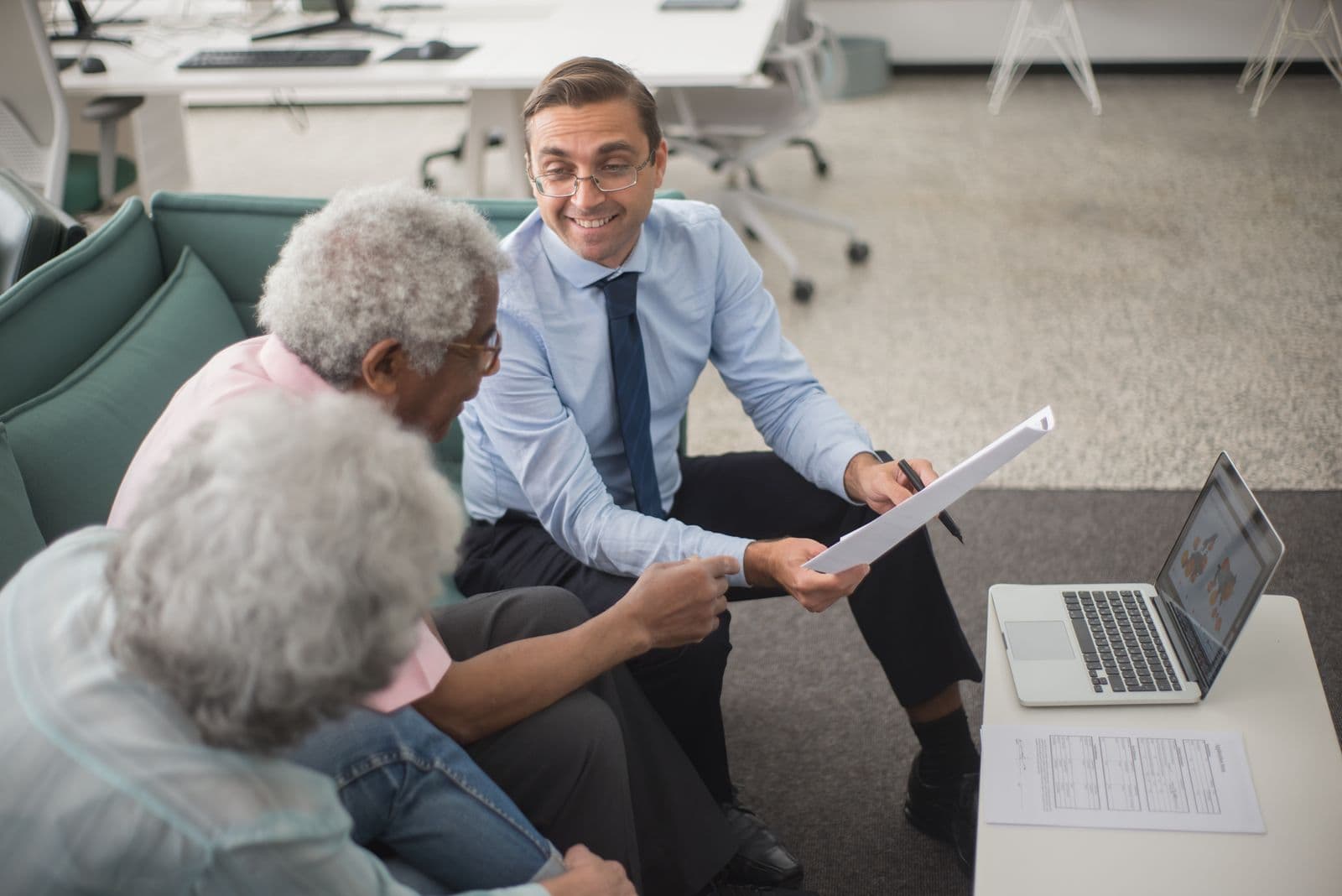 A consultant meeting with a retired couple