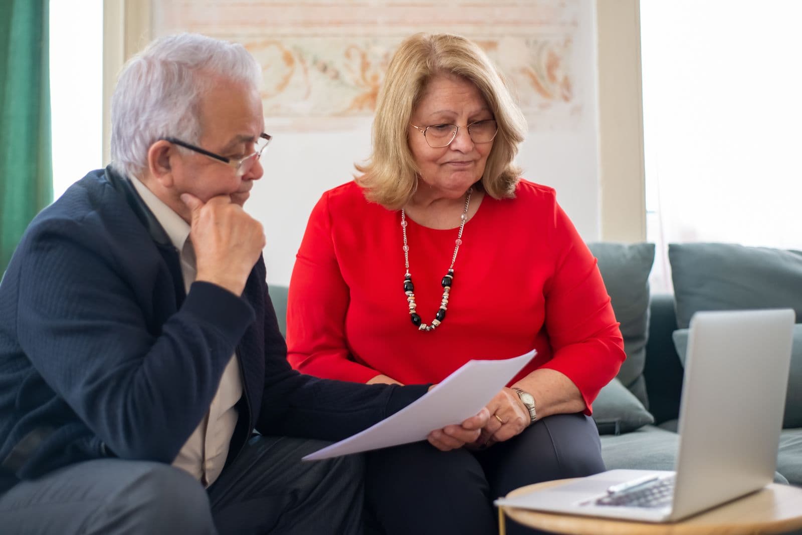 A senior couple consulting a licensed advisor